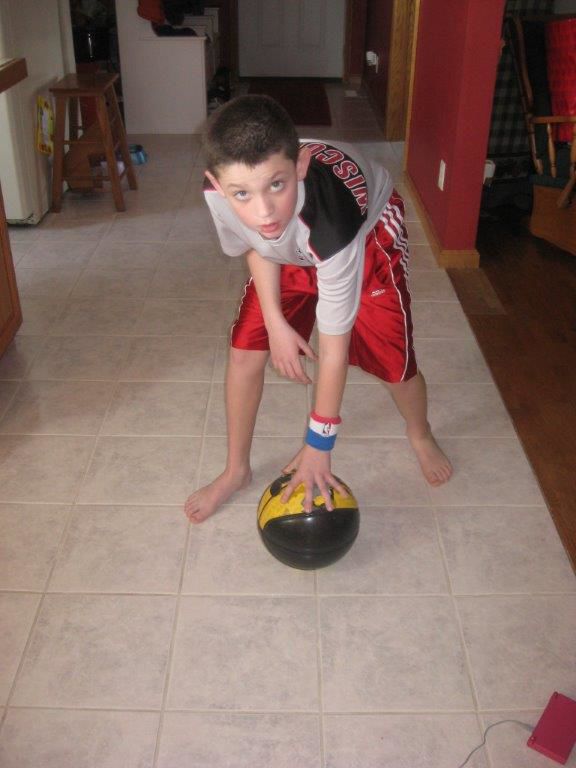 Charlie Yoder ball handling skills in the kitchen age 5
